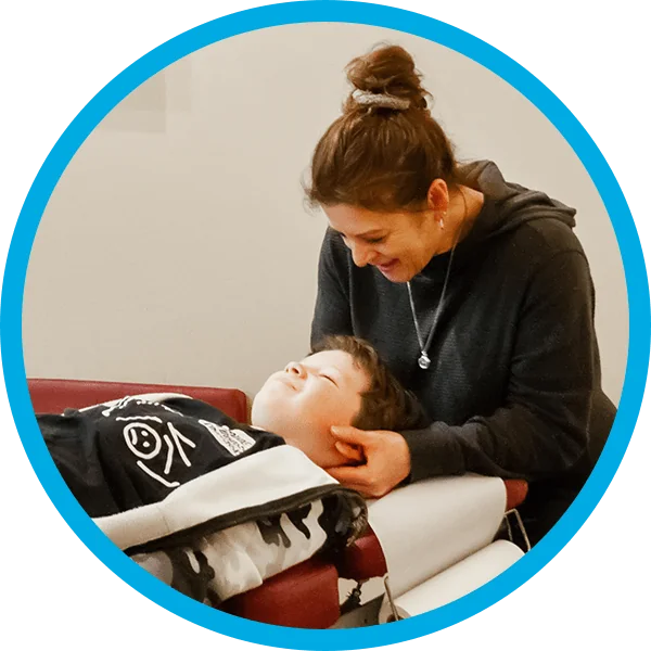 Chiropractor using activator instrument for gentle adjustment